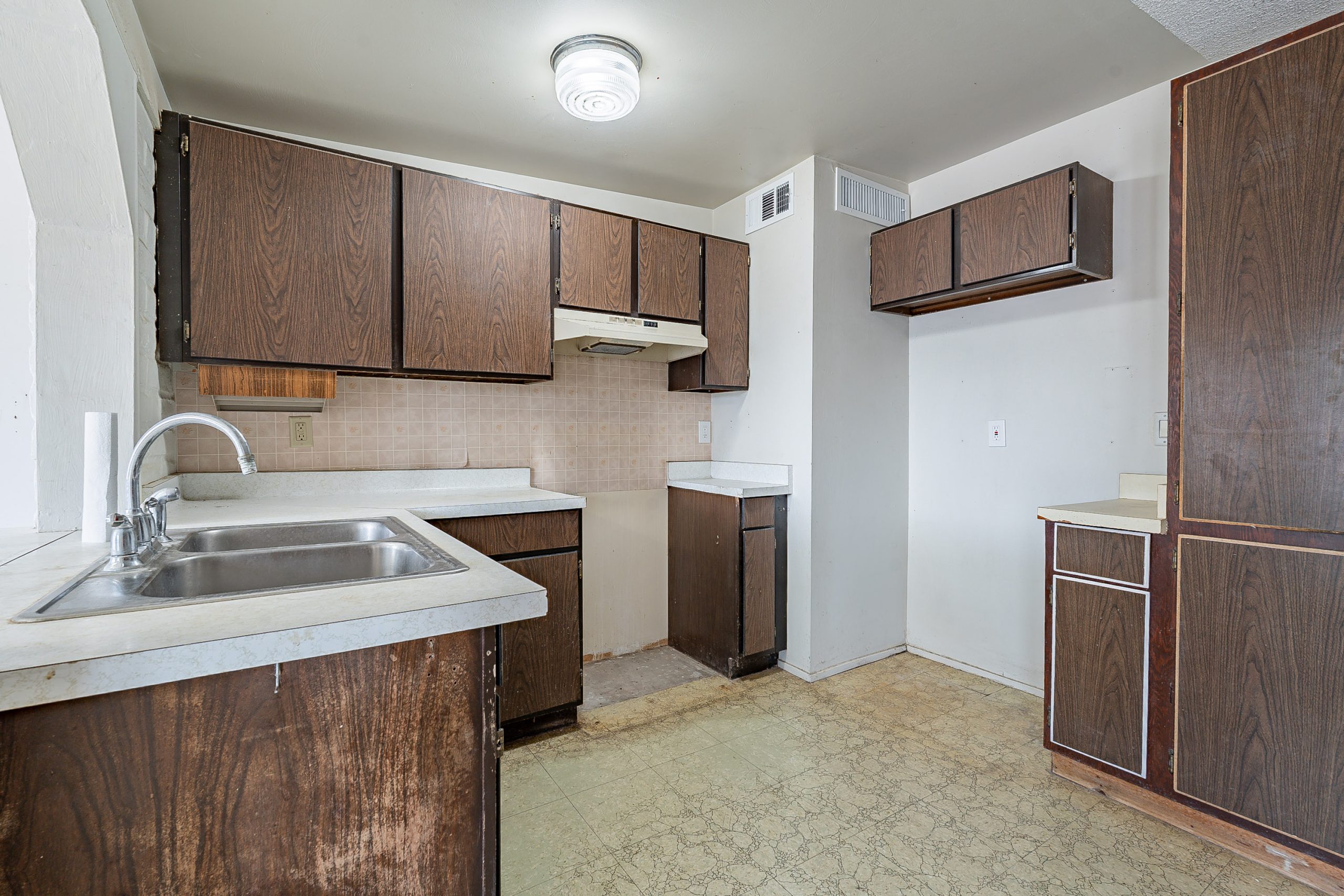 Kitchen missing appliances and needed repairs and upgrades being sold as is.