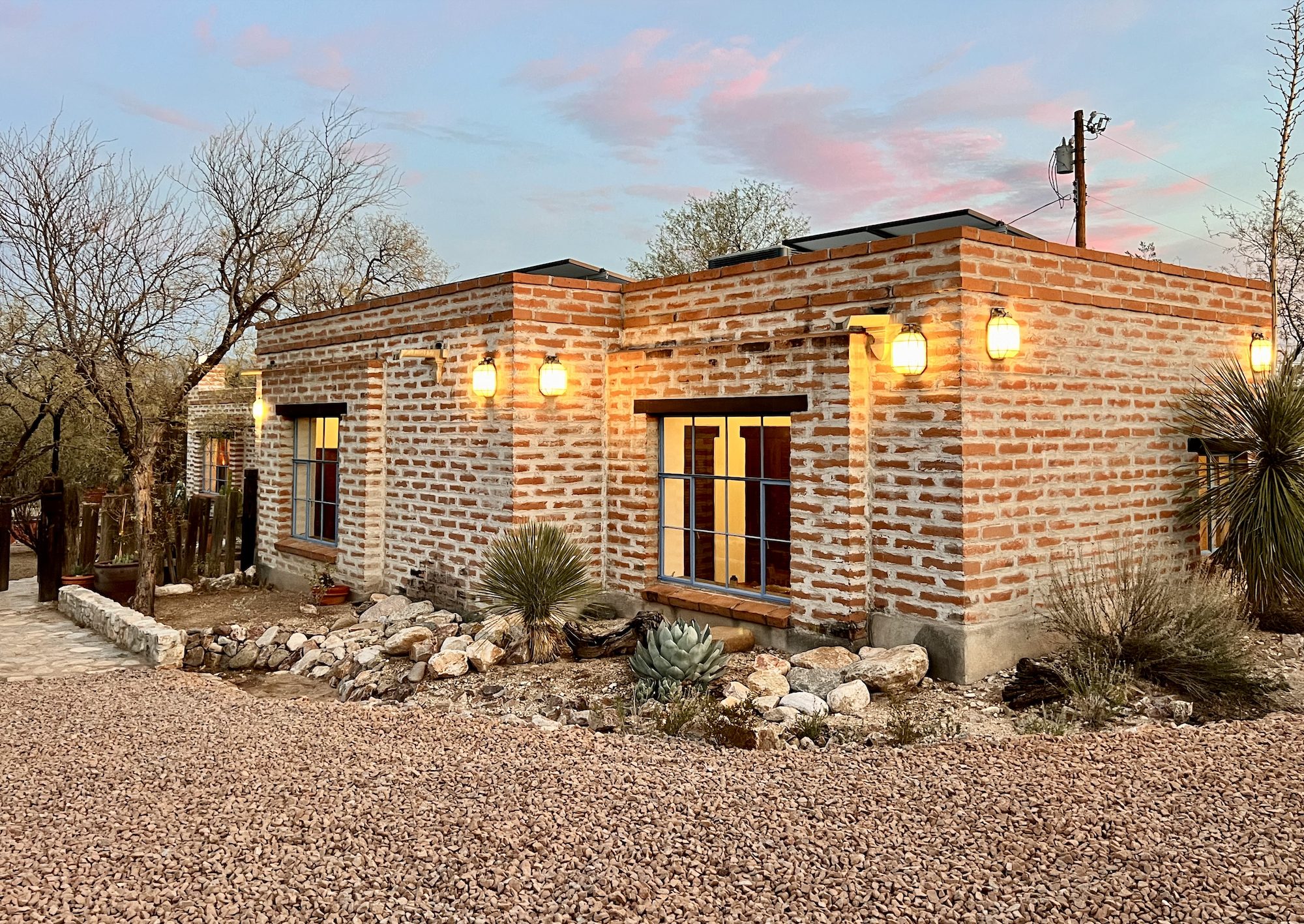 A classic burnt adobe home in Tucson showcasing thick masonry walls and timeless Southwestern architecture.